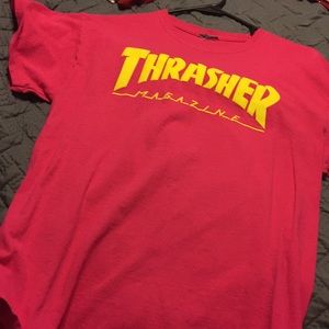 Pink thrasher shirt.
